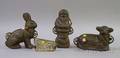 Three Cast Iron Figural Food Molds and a Tin Santas Sleigh Chocolate Mold