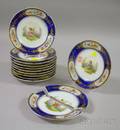 Set of Eleven Continental Gilt and Handpainted Floral and Child Decorated Cobalt Banded Porcelain Plates