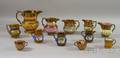 Nine Staffordshire Copper Lustre Jugs and Three Coffee Cups