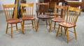 Four Windsor Thumbback Side Chairs and an Armchair