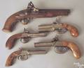 Four double hammer percussion pistols
