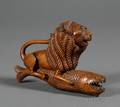 Carved Walnut Allegorical Figure of a Lion on a Fish