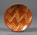 Redware Plate with Yellow Slip Wavy Line Decoration