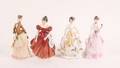 Four Porcelain Figurines of Women in Fine Dress