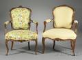 Two Louis XVstyle Fruitwood Upholstered Fauteuils