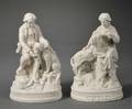 Pair of Parian Figures of a Young Man and Woman with Dogs