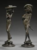 Pair of Patinated Metal Figural Candlesticks