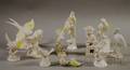 Seven White Porcelain Bird Figures and Four Bisque Bird Figures