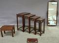 Four Asian Carved Hardwood Nesting Stands a Carved Rosewood Mirror a Carved Hardwood Stand and a Small Tray
