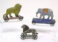 Three American tin platform toys