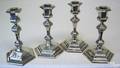 Set of 4 weighted sterling candlesticks by Shreve