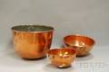 Two Copper Bowls and an Open Vessel