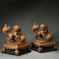 Two Gilt Wood Foo Lions