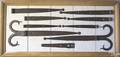 Framed group of wrought iron hardware ca 1800