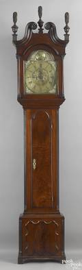 Philadelphia Chippendale walnut tall case clock ca 1765 the bonnet top with original flame finials enclosing 8day brass works inscribed Owen Biddle Philadelphia beneath an arch inscribed The man is yet unborn who duly weighs every hour above 