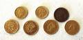Seven US gold 1 dollar coins
