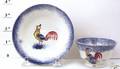 Blue spatter miniature cup and saucer with yellow blue and red rooster
