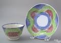 Unusual miniature red green and blue rainbow spatter cup and saucer