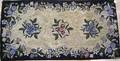 Two American hooked rugs with floral decoration