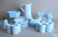 Eighteen pieces of blue milk glass tableware