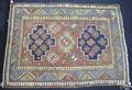 Kazak throw rug