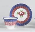 Red and blue rainbow cup and saucer