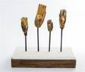 A Group of Four Southeast Asian Giltwood Hands of Buddha