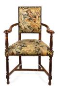 A Baroque Style Stained Fruitwood and Tapestry Upholstered Armchair