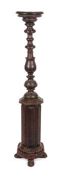 A Carved Walnut Pedestal